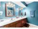 Double vanity bathroom with a teal color scheme at 4543 W Lane Ave, Glendale, AZ 85301