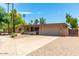 Single-story home with a two-car garage and landscaped yard at 4543 W Lane Ave, Glendale, AZ 85301