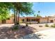 Single-story home with a two-car garage and landscaped yard at 4543 W Lane Ave, Glendale, AZ 85301