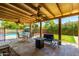 Covered patio with seating area overlooking the pool at 4543 W Lane Ave, Glendale, AZ 85301