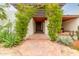 Front entry with terracotta tile and lush greenery at 4622 E Palo Verde Dr, Phoenix, AZ 85018