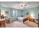 Serene bedroom with light teal walls and comfortable seating at 520 S Greenfield Rd # 20, Mesa, AZ 85206