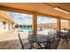 Community pool area with patio tables and chairs at 520 S Greenfield Rd # 20, Mesa, AZ 85206