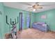 Bedroom with twin bed, exercise equipment and large window at 526 N Hobson Plz, Mesa, AZ 85203