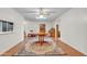 Dining room features a round table, area rug, and ceiling fan at 526 N Hobson Plz, Mesa, AZ 85203