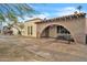 Front view of a charming single story home with arched entryway at 526 N Hobson Plz, Mesa, AZ 85203