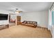 Living room with brown leather sofa and view into game room at 526 N Hobson Plz, Mesa, AZ 85203