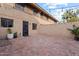 Private brick patio with string lights and landscaping at 5330 N Central Ave # 3, Phoenix, AZ 85012