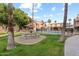 Community pool and fountain with lush landscaping at 5330 N Central Ave # 3, Phoenix, AZ 85012