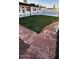 Landscaped backyard with brick pathway and pool at 5919 S Lakeshore Dr, Tempe, AZ 85283