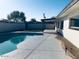 Backyard featuring a sparkling pool, extended patio and landscaped surroundings at 5919 S Lakeshore Dr, Tempe, AZ 85283