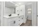 Double vanity bathroom with modern fixtures and a quartz countertop at 5919 S Lakeshore Dr, Tempe, AZ 85283