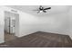 Well-lit bedroom featuring neutral carpeting and a ceiling fan at 5919 S Lakeshore Dr, Tempe, AZ 85283