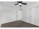 Bedroom with ceiling fan and built-in closet at 5919 S Lakeshore Dr, Tempe, AZ 85283