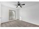 Well-lit bedroom featuring a large window and ceiling fan at 5919 S Lakeshore Dr, Tempe, AZ 85283