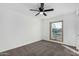 Spacious bedroom with a window and ceiling fan at 5919 S Lakeshore Dr, Tempe, AZ 85283