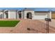 House exterior featuring a remodeled single story home with artificial turf and rock landscaping at 5919 S Lakeshore Dr, Tempe, AZ 85283