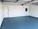 Clean and spacious two-car garage with epoxy flooring, offering ample parking and storage at 5919 S Lakeshore Dr, Tempe, AZ 85283