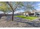 Spacious backyard with artificial turf, pergola, and mature trees at 5933 N 189Th Dr, Litchfield Park, AZ 85340