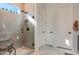 Spa-like bathroom with glass shower, herringbone tile floor, and modern vanity at 5933 N 189Th Dr, Litchfield Park, AZ 85340