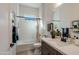 Stylish bathroom with hexagon tile, soaking tub, and updated fixtures at 5933 N 189Th Dr, Litchfield Park, AZ 85340