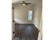 Spacious bedroom with double door closet and wood-look flooring at 600 W Grove Pkwy # 2067, Tempe, AZ 85283