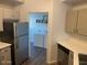 Kitchen with stainless steel refrigerator and laundry area at 600 W Grove Pkwy # 2067, Tempe, AZ 85283