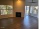 Bright living room with fireplace and sliding glass door to patio at 600 W Grove Pkwy # 2067, Tempe, AZ 85283