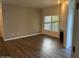 Spacious living room with hardwood floors and a fireplace at 600 W Grove Pkwy # 2067, Tempe, AZ 85283