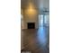 Bright living room featuring fireplace and sliding glass door to patio at 600 W Grove Pkwy # 2067, Tempe, AZ 85283