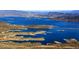 Stunning aerial view of a lake with islands and mountains at 6118 N 183Rd Ave, Waddell, AZ 85355