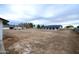 Large backyard with a view of the home and surrounding landscape at 6118 N 183Rd Ave, Waddell, AZ 85355