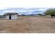 Large backyard with shed and distant mountain views at 6118 N 183Rd Ave, Waddell, AZ 85355