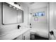 Modern bathroom with white vanity and bathtub at 6118 N 183Rd Ave, Waddell, AZ 85355