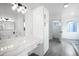 Bathroom with white cabinets and marble countertop at 6118 N 183Rd Ave, Waddell, AZ 85355