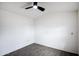 Spacious bedroom with ceiling fan and grey tile floor at 6118 N 183Rd Ave, Waddell, AZ 85355