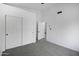 Bedroom with double door closet and grey carpet at 6118 N 183Rd Ave, Waddell, AZ 85355