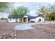 Single-story home with curved driveway and desert landscaping at 6118 N 183Rd Ave, Waddell, AZ 85355