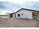 House exterior with a black garage door and side yard at 6118 N 183Rd Ave, Waddell, AZ 85355