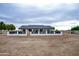 Modern ranch-style home with a black roof and white exterior at 6118 N 183Rd Ave, Waddell, AZ 85355