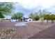 House exterior view showcasing landscaping and driveway at 6118 N 183Rd Ave, Waddell, AZ 85355