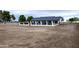 White and black modern home with a covered patio at 6118 N 183Rd Ave, Waddell, AZ 85355