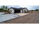 Black garage door and side yard view of house at 6118 N 183Rd Ave, Waddell, AZ 85355