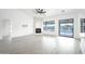 Spacious living room featuring tile floors, fireplace, and pool view at 6118 N 183Rd Ave, Waddell, AZ 85355