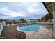 Inviting kidney-shaped pool with a view of the mountains at 6118 N 183Rd Ave, Waddell, AZ 85355