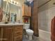 Clean bathroom with a tub, toilet, and vanity at 650 N Hawes Rd # 4820, Mesa, AZ 85207