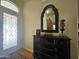 Entryway with a dark dresser, mirror, and decorative vase at 650 N Hawes Rd # 4820, Mesa, AZ 85207