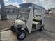 Tan golf cart with beige top and clear windows at 650 N Hawes Rd # 4820, Mesa, AZ 85207