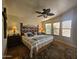 Large main bedroom with ceiling fan and wooden flooring at 650 N Hawes Rd # 4820, Mesa, AZ 85207