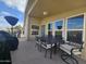 Back patio with table, chairs, and grill at 650 N Hawes Rd # 4820, Mesa, AZ 85207